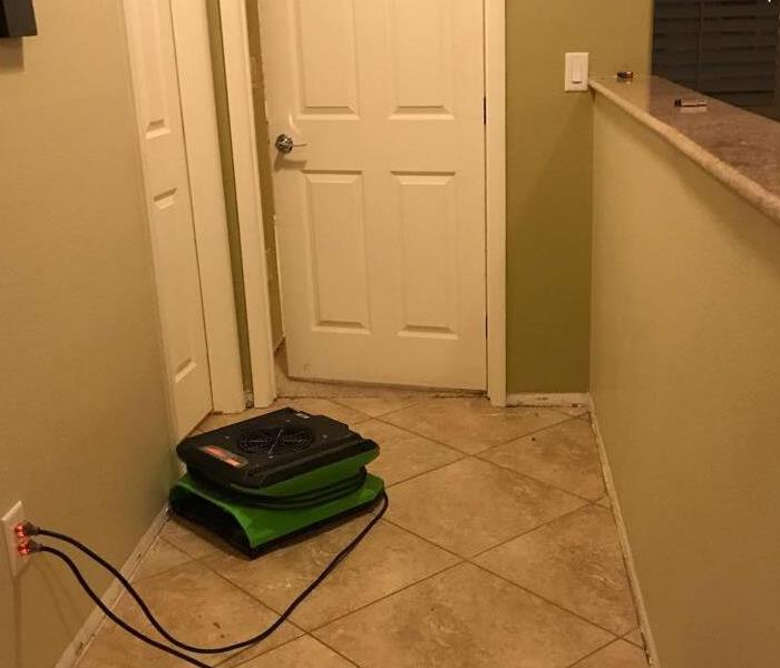 Green air movers in a hallway.