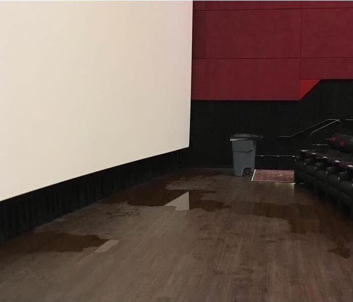 Water damage on a floor of a theater